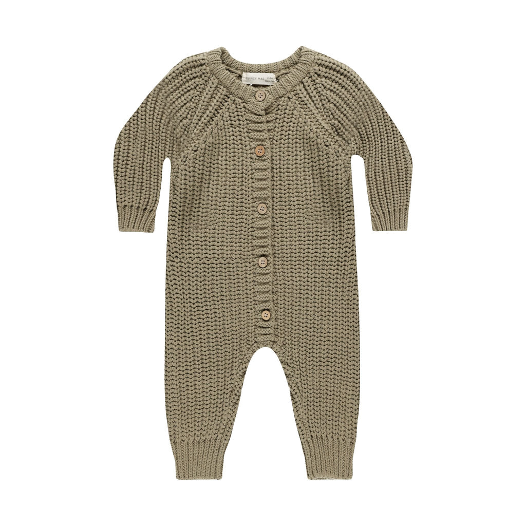 flatlay of chunky knit jumpsuit in olive on white background