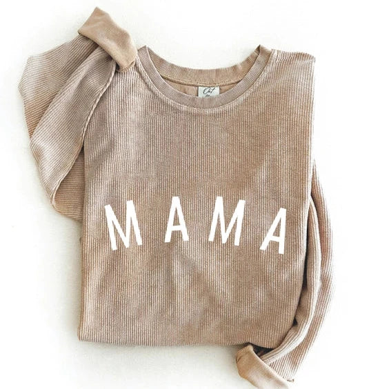 flatlay of mama corded sweater on white background 