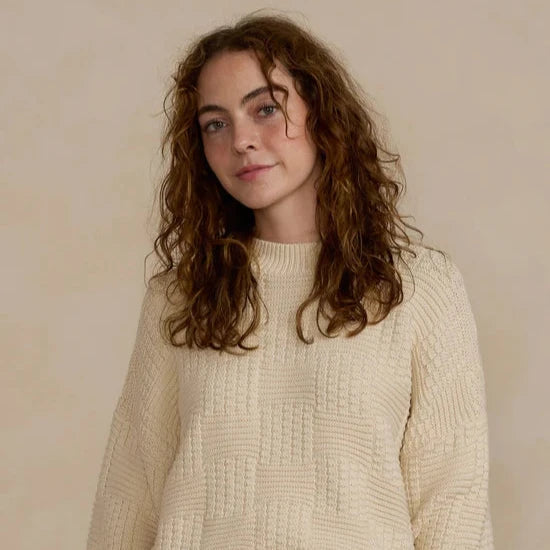 carolina sweater on model with beige background 