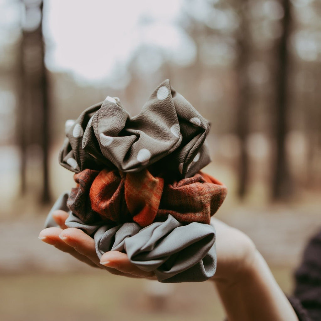 scrunchie polka dot held in hand