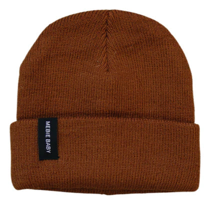 flatlay of brown beanie on white background 