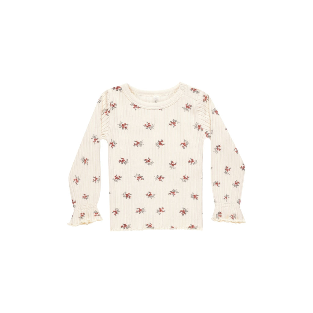 flatlay of longsleeve floral on white background 