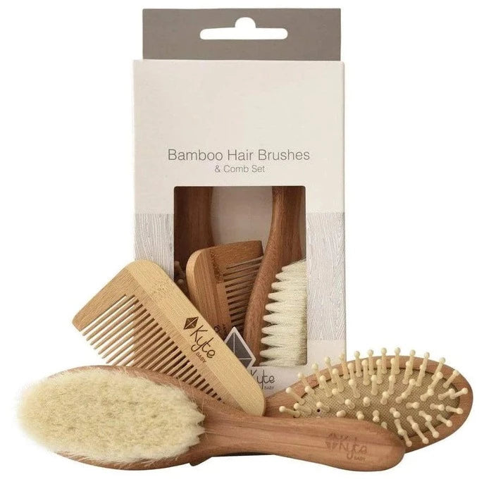 Cradle Cap Brush by Kyte Baby. white background with brush set and pieces 