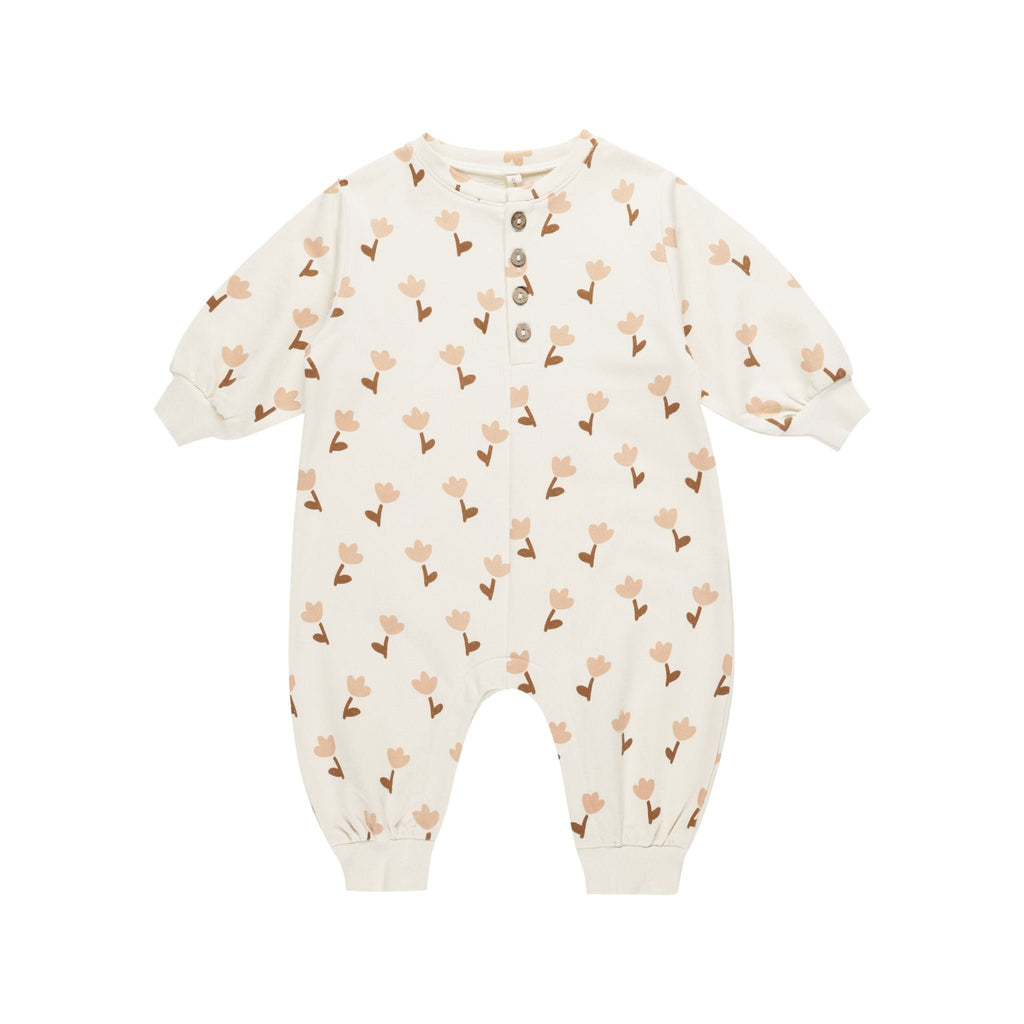 flatlay of tulips jumpsuit on white background 