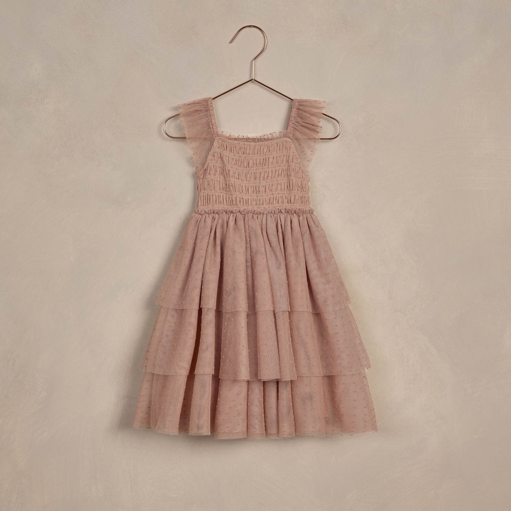 flatlay dusty rose dress on beige 