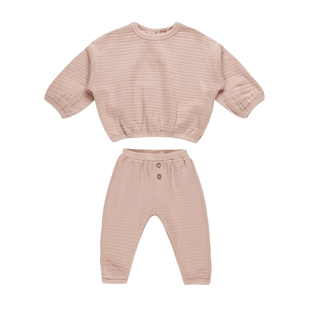 flatlay 2 piece blush set on white background 