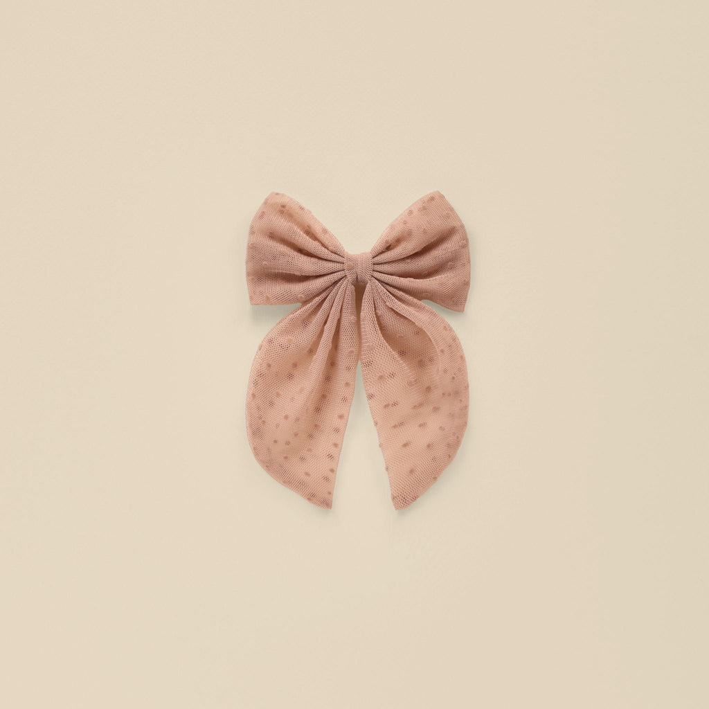 oversized bow flatlay in dusty rose