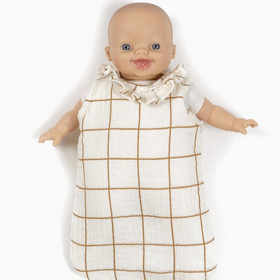 sleeping bag with doll in it on white background 