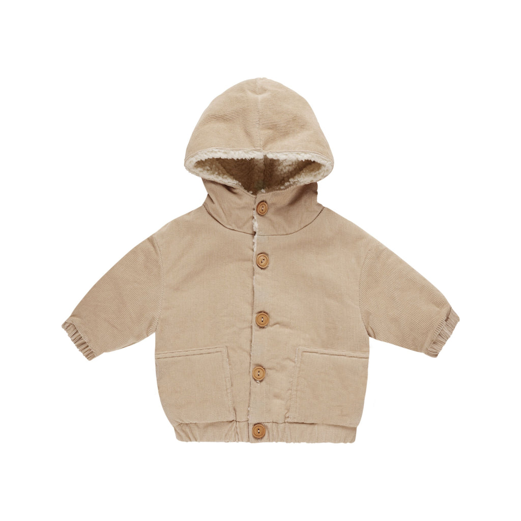 flatlay of corduroy jacket on white background 