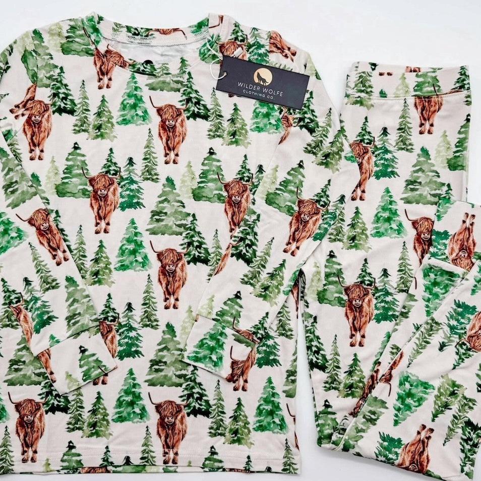 two piece pj with trees and cows flat lay