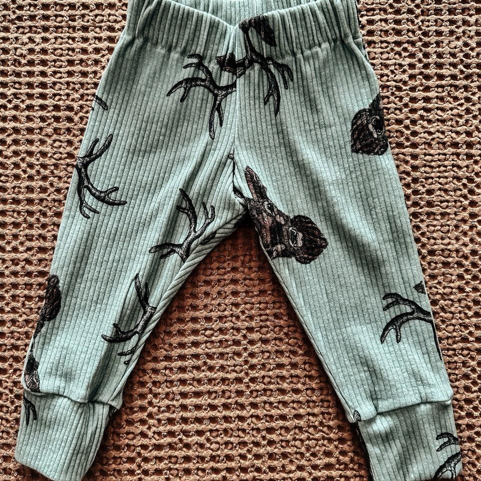 green deer joggers flat lay