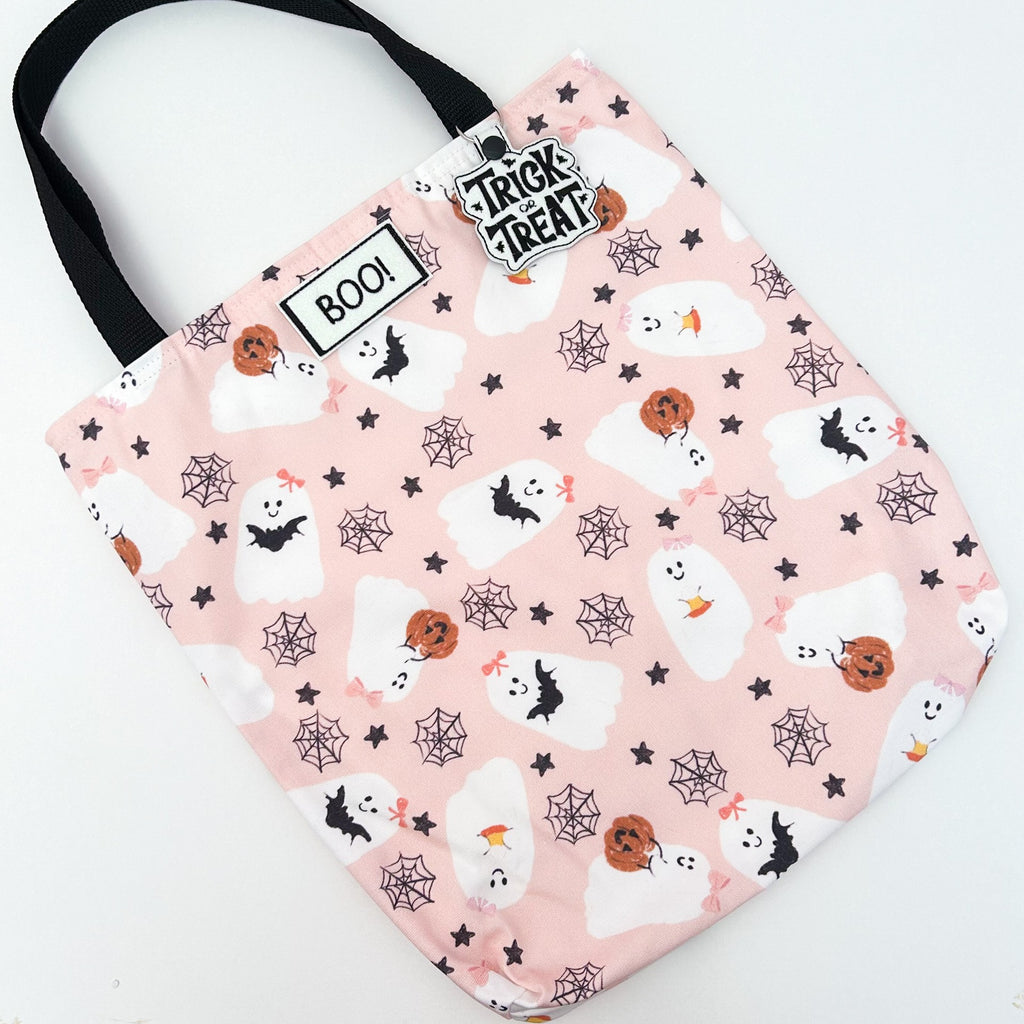 flatlay halloween bags in bats on white background 