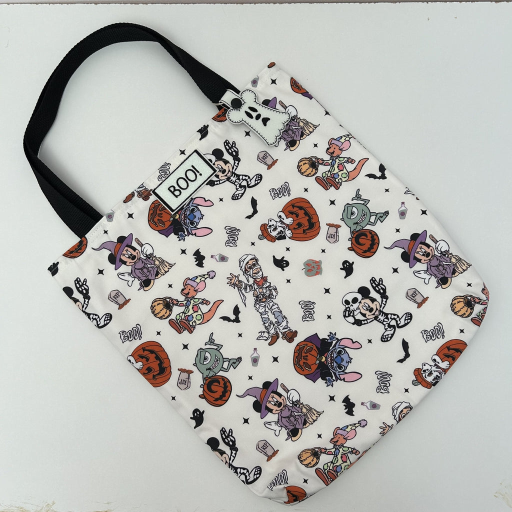 flatlay of boo bag with mouse on them 