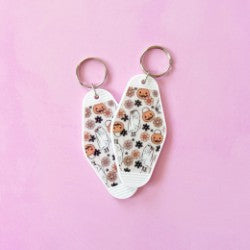 keychain with pumpkin & ghost on pink background