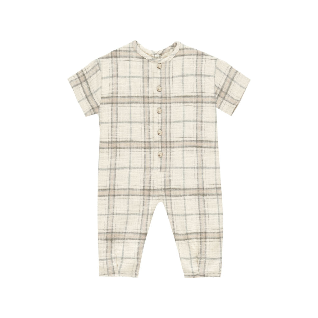 flatlay of plaid jumpsuit on white background 