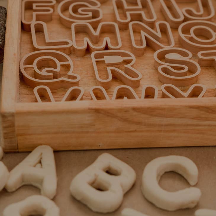 Alphabet Eco Cutter Set by Kinfolk Pantry letters on tray with play dough