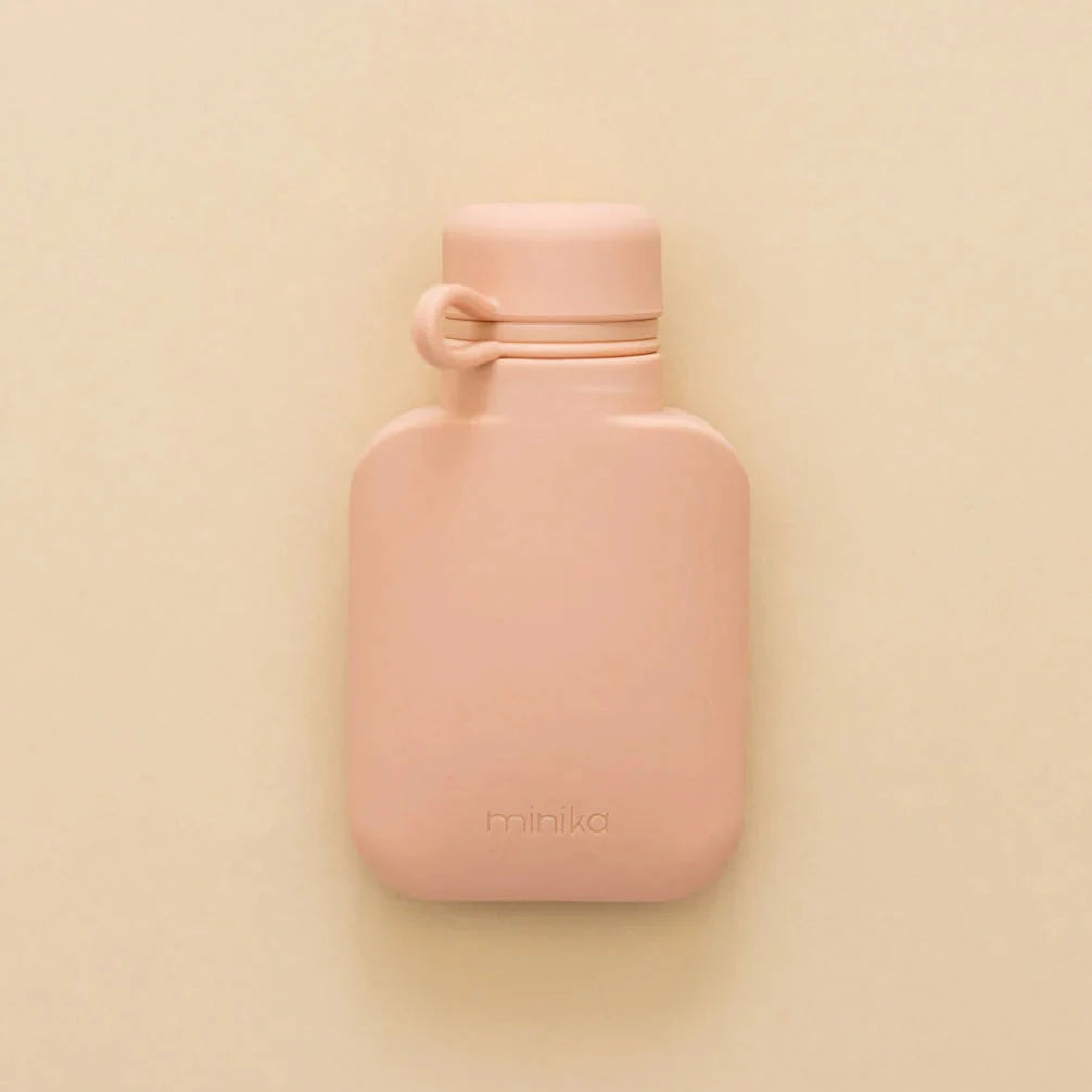 Smoothie bottle by Minika on beige background