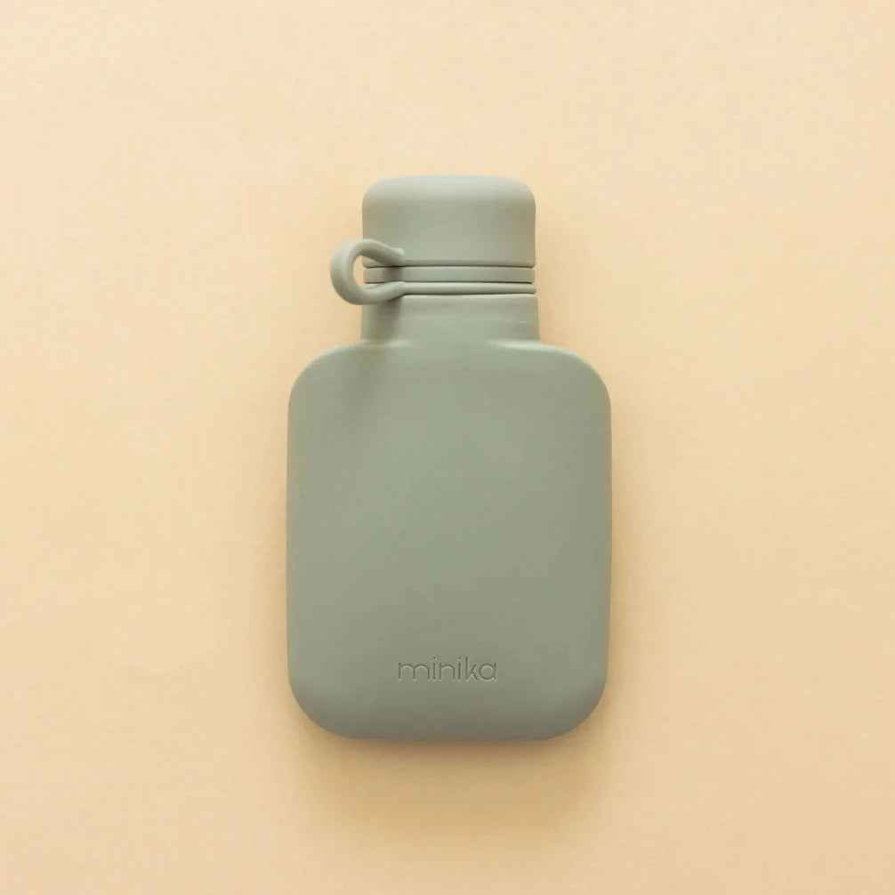 Smoothie bottle by Minika on beige background