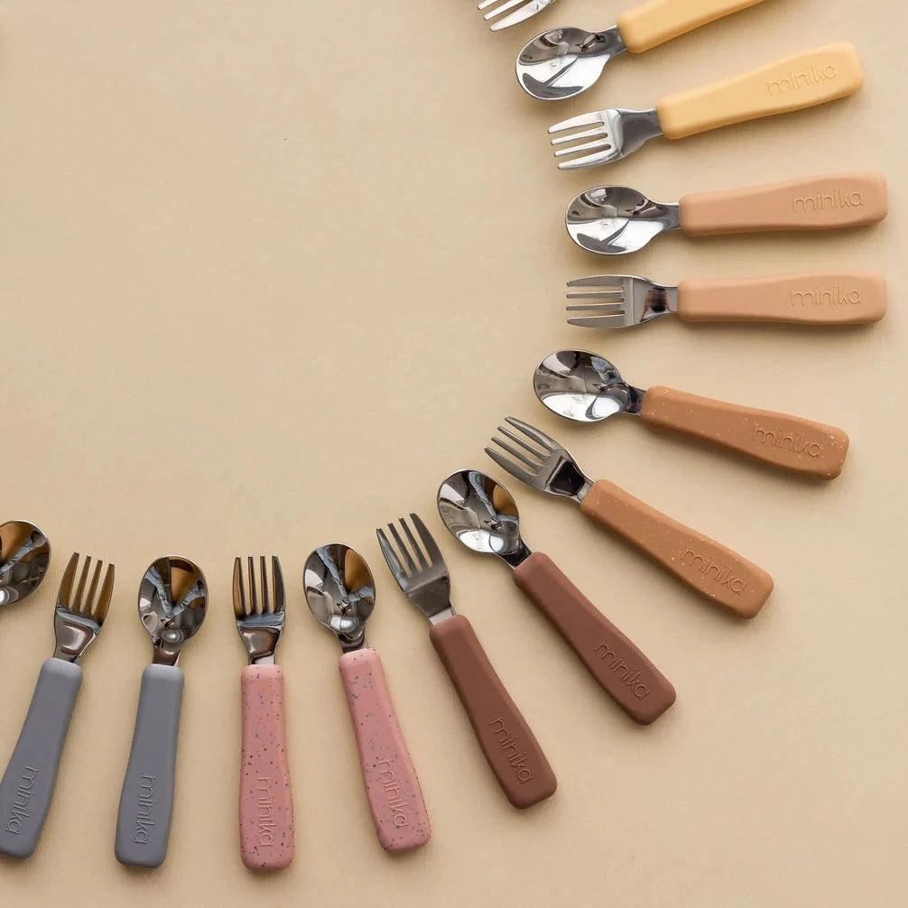 Fork and Spoon Sets by Minika on beige background
