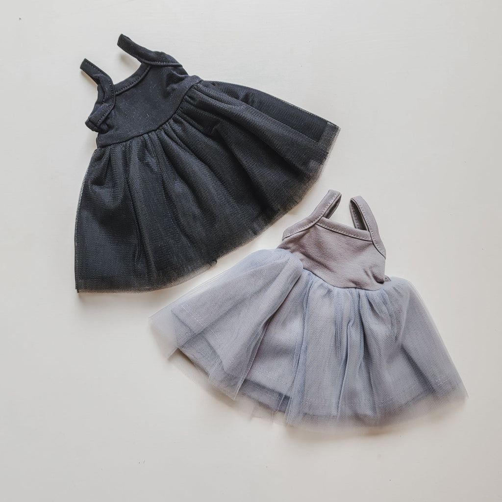 White background with Rosella Tutu for Dolls by Minikane, both colours laying out.