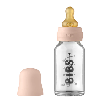 110ml Glass bottle that says "BIBS" in black along the side, with a blush bottle lid by Bibs