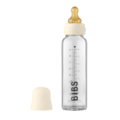 225 ml Glass bottle that says "BIBS" in black along the side, with an ivory bottle lid by Bibs