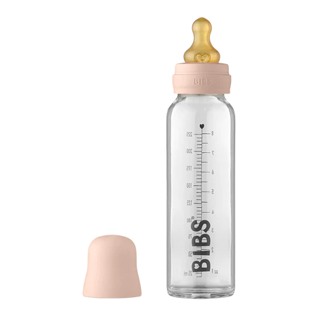 225 ml Glass bottle that says "BIBS" in black along the side, with a blush bottle lid by Bibs