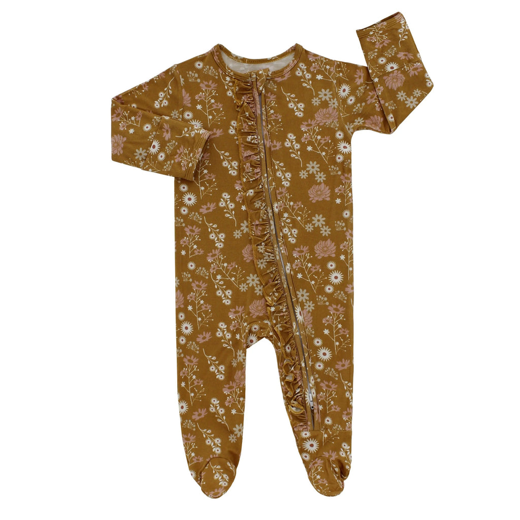 White background withflatlay of Bamboo Footie Sleeper in Mustard Floral by Emerson and Friends.
