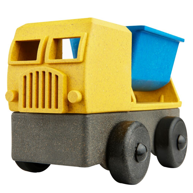 White background with 3D Tipper Truck by Luke's Factory. Truck is yellow, with a blue tipper back, and black wheels.