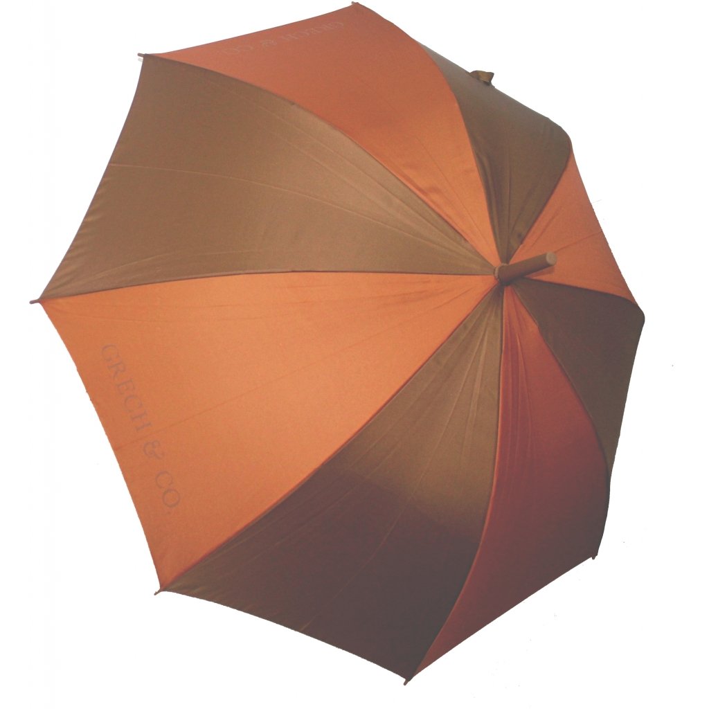 White background with Adult Sustainable Umbrella in Tierra by Grech & Co. Alternating colours of rust & earthy deep brown on each panel.