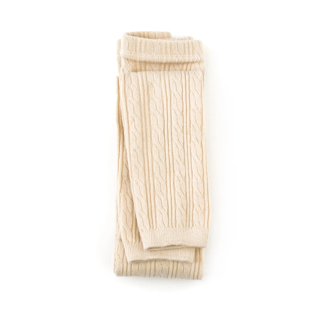 White background with Cable Knit Footless Tights in Vanilla by Little Stocking Co.