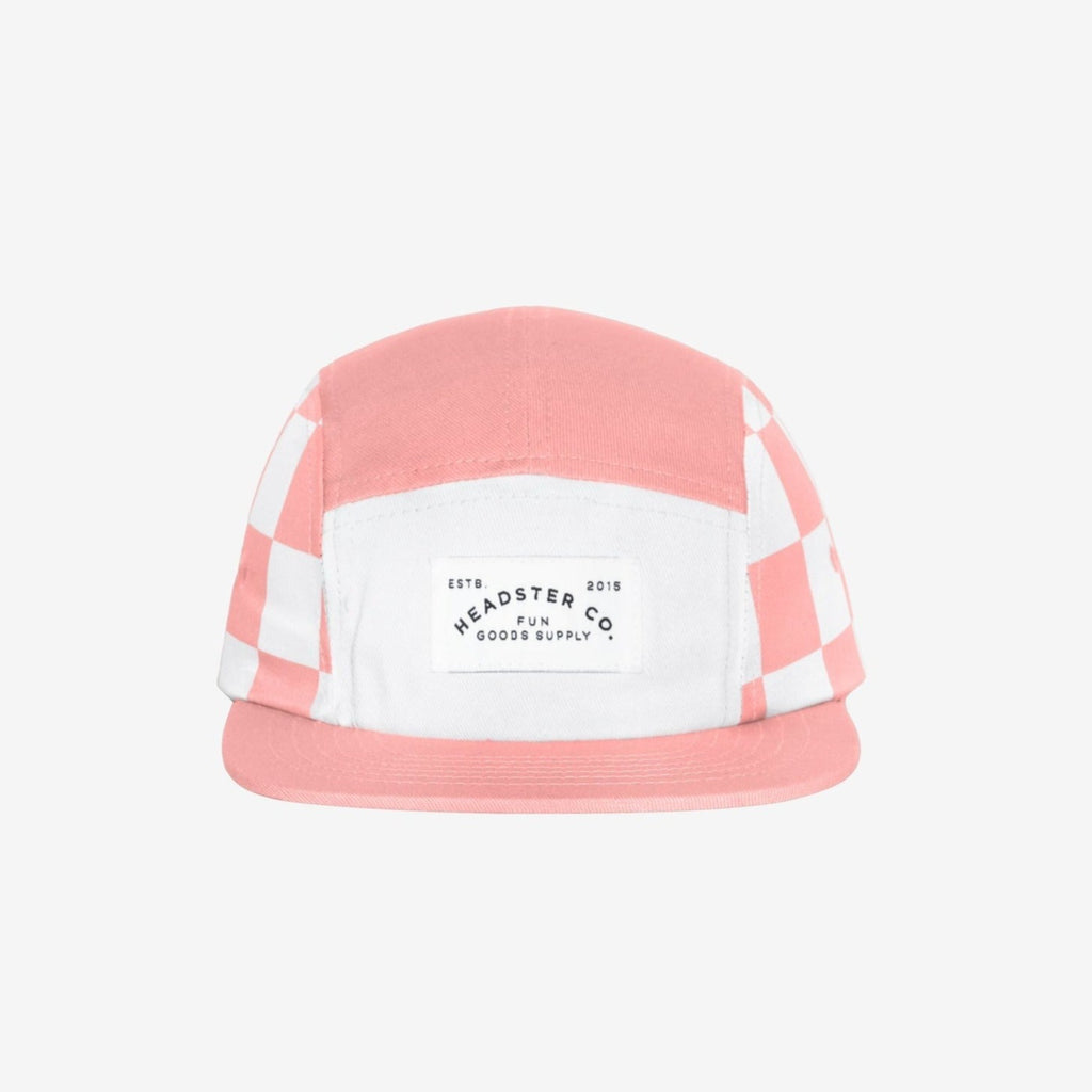 Check Yourself Five Panel Peaches Hat by Headster, white background and surface. 