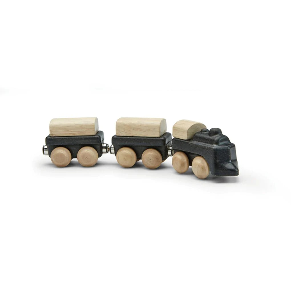 White background with the Classic Train by PlanToys. Train looks very classic on the front, with black and wood details.