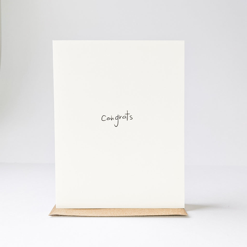 White background showing the front of the Congrats Card by Under The Stairs Paper Co. 