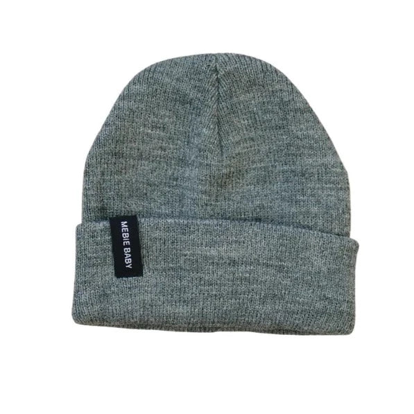 White background with Dark grey Beanie by Mebie Baby. Beanie is a dark heathered grey, with a cuff, and a black rectangular tag that says "Mebie Baby" in white.