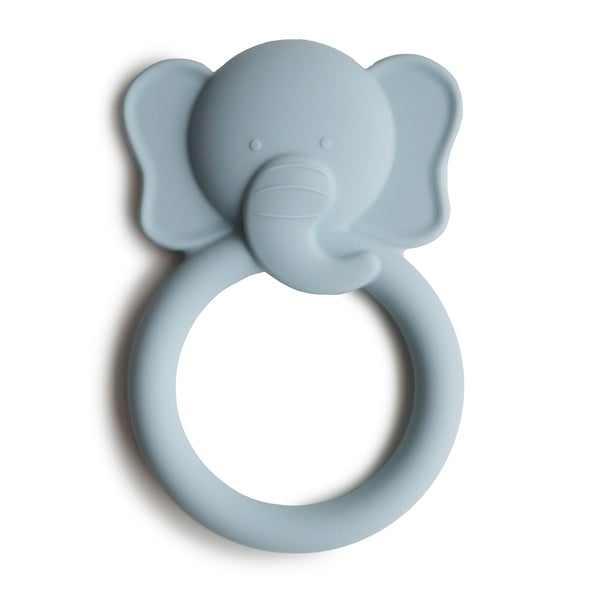 White background with Elephant Teether by Mushie. Teether is pale blue silicone with a rounded handle, and an elephant head on the top.