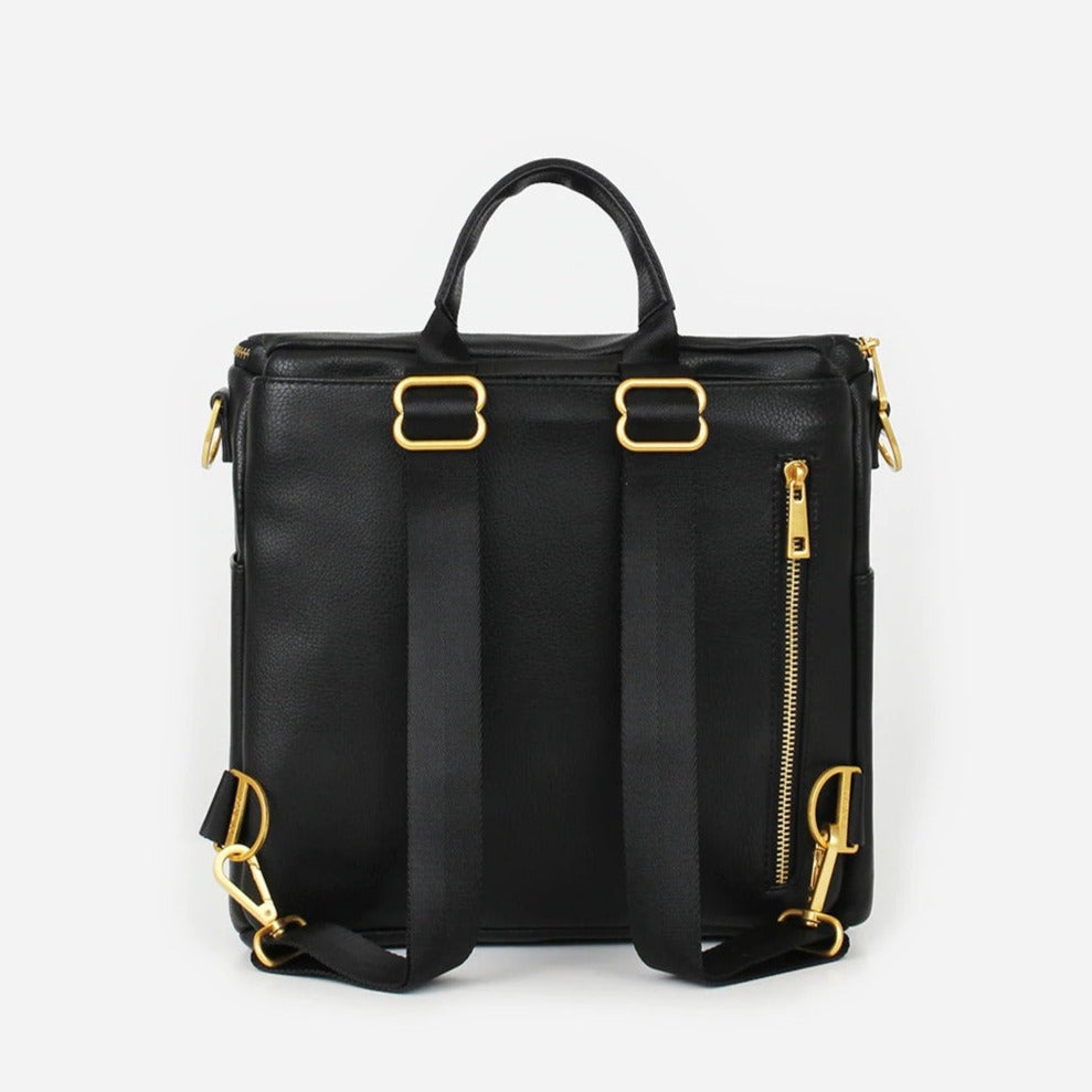 White background with backside view of Mini Bag in Black by Fawn Design. Showing the gold accents on the zipper.