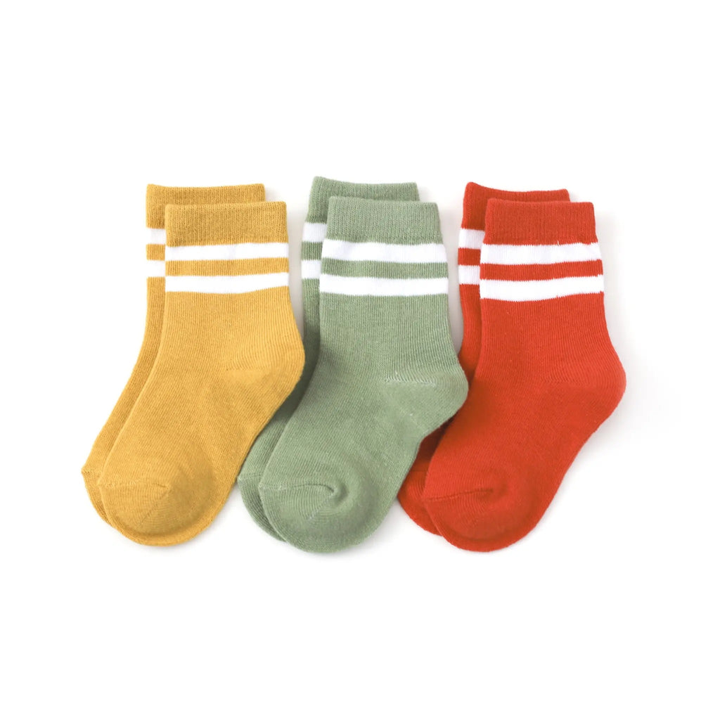 White background with Garden Striped Midi 3-Pair Pack by Little Stocking Co. From left to right, yellow, green, and red.