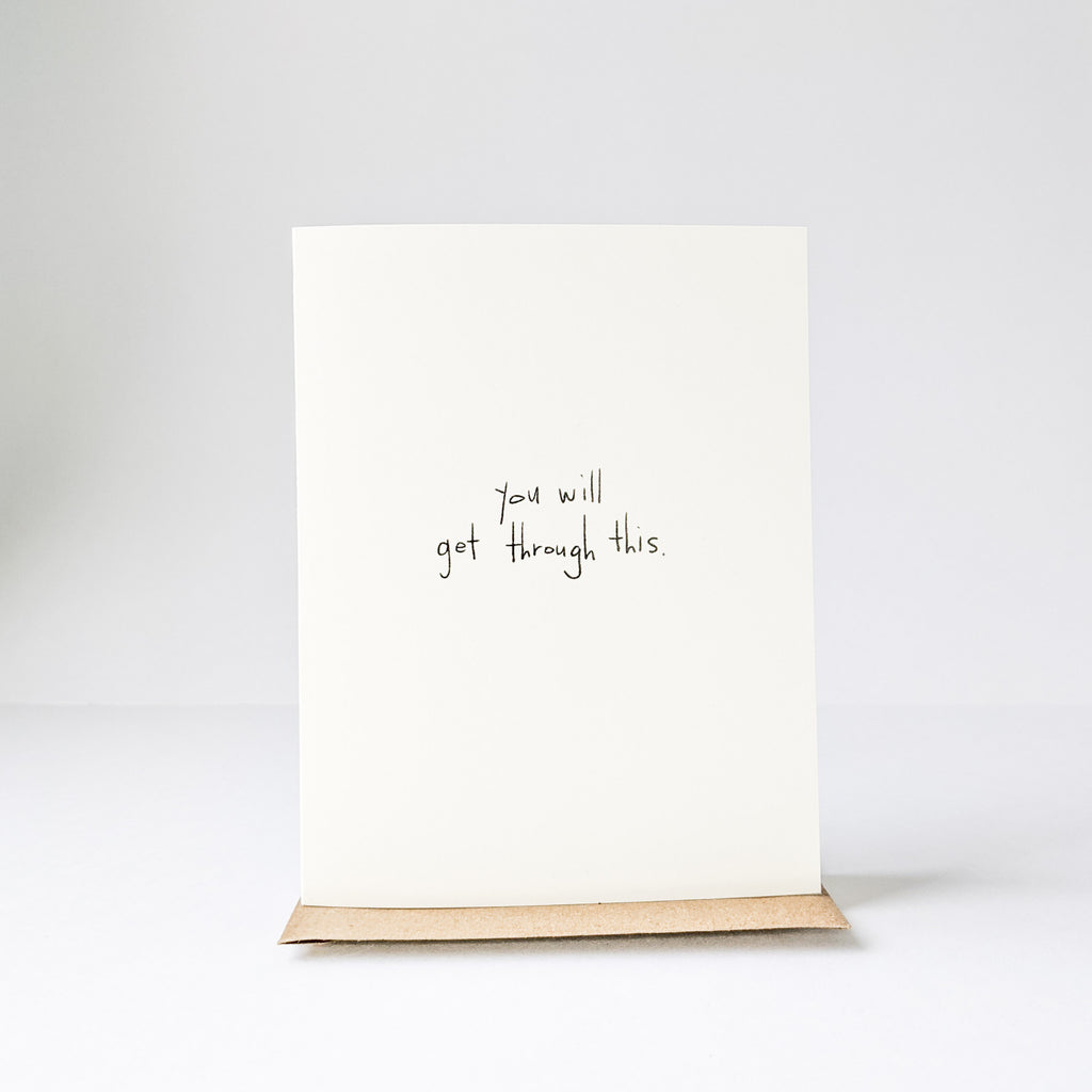 White background with the Get Through This Card by Under Tje Stairs Paper Co. Card is cream and says "you will get through this" in black.