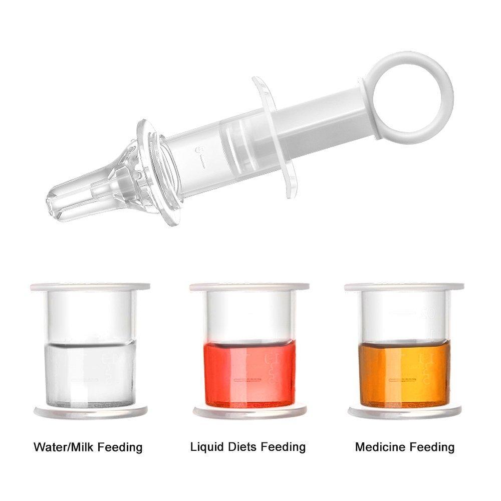 White background with Oral Feeding Syringe by Haakaa. Showing the measuring cup and the syringe.