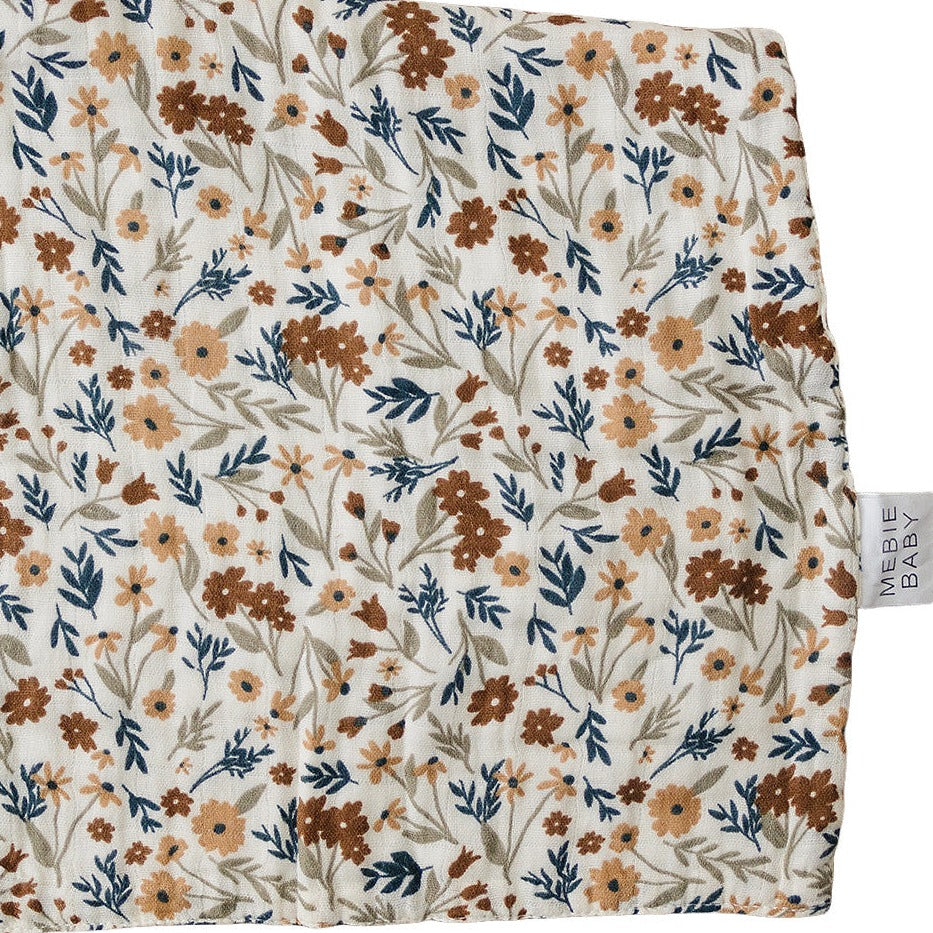 Harvest Floral Burp Cloth by Mebie Baby in front of a white background. 