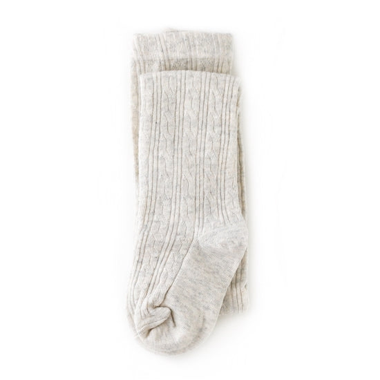 White background with Cable Knit Tights in Heathered Ivory by Little Stocking Co.
