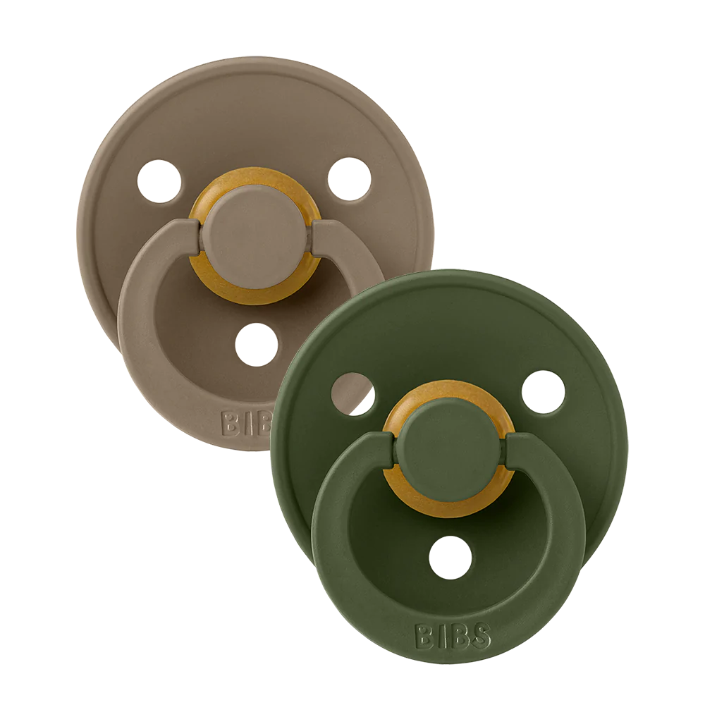 Clear background with the Size 1 Pacifiers in Hunter Green & Dark Oak by Bibs. Set comes with 1 dark oak pacifier, and 1 hunter green pacifier.