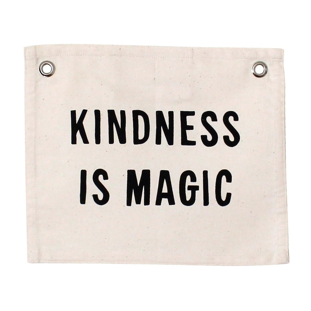 White background with Kindness Is Magic Banner by Imani Collective. Banner is canvas, and text is black.