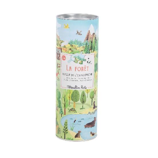 White background with La Foret Explorateur Puzzle by Moulin Roty in it's packaging. The packaging is cylindrical with a forest scene.