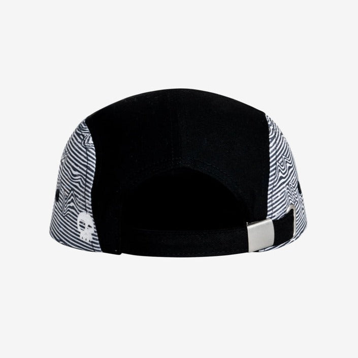 Lineup Five Panel Black by Headster with white background and surface.
