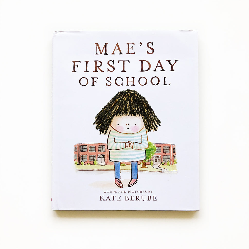 White background with the book Mae's First Day of School by Kate Berube. Cover is white with a little girl standing infront of a school.
