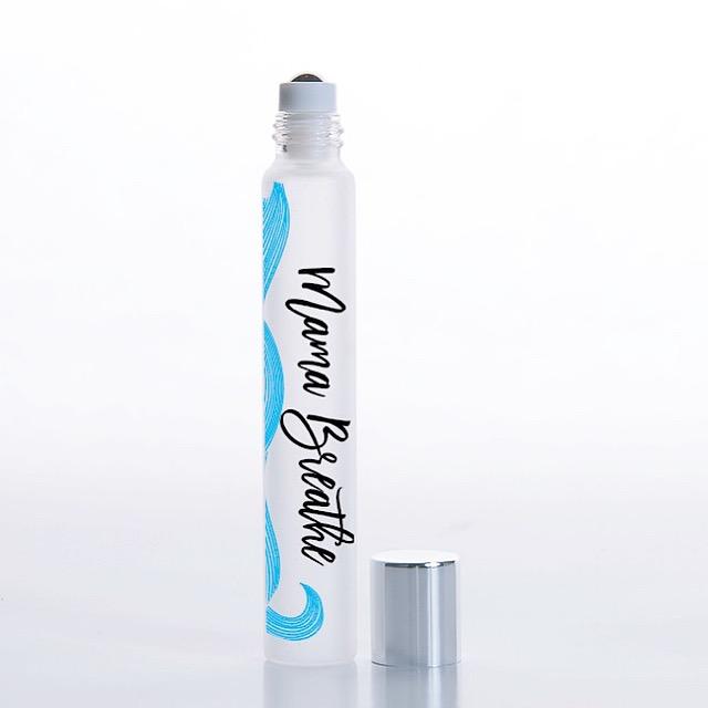 White background with rollerball of Mama Breathe Essential Oil Blend by Jane + Thunder.