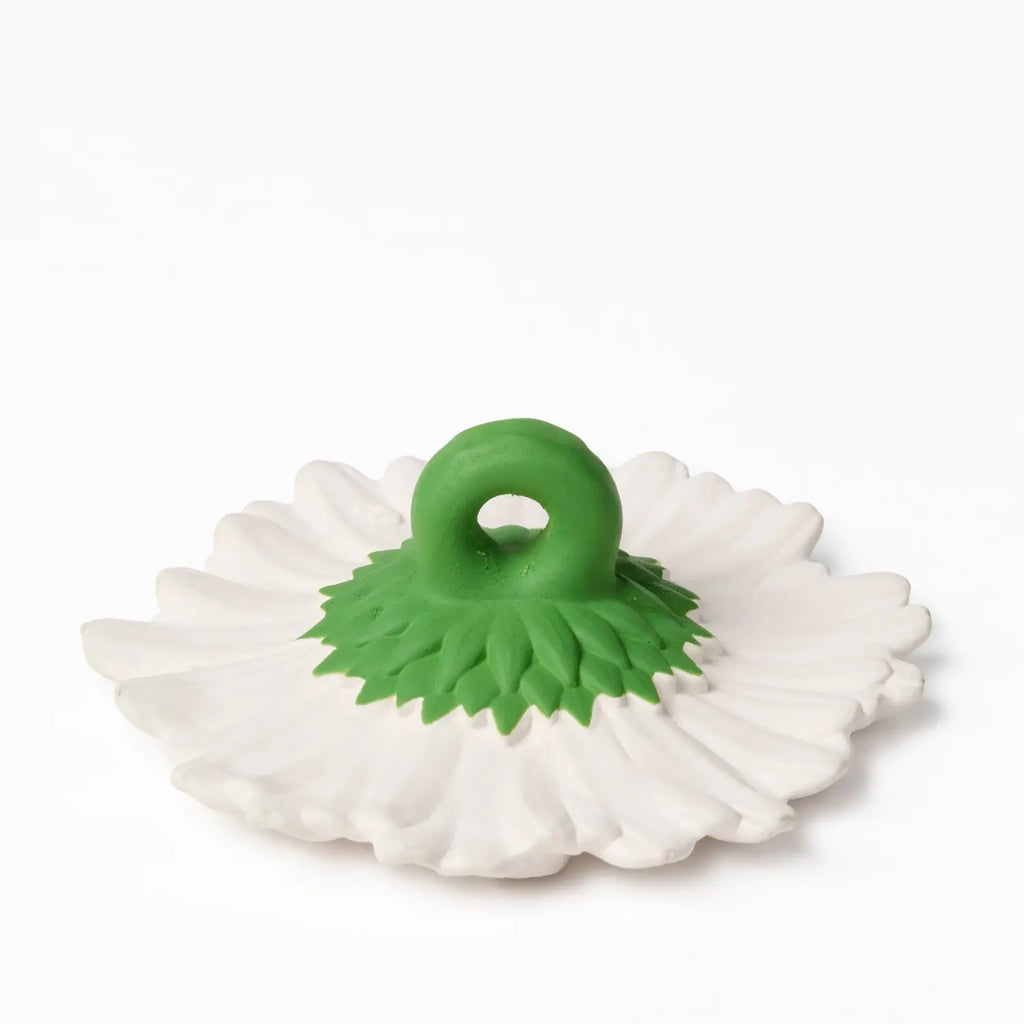 White background with a side view of Margarita The Daisy Teether by Oli & Carol. Shows the green stem, with a circle to hold.