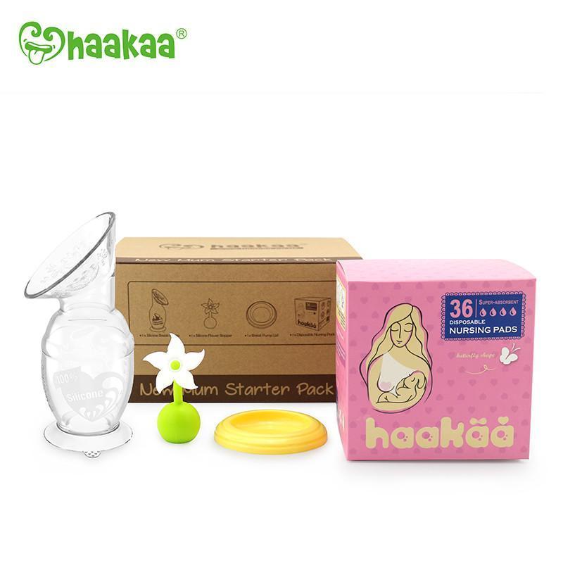White background with New Mum Starter Kit by Haakaa. With the box it comes in, and all the items displayed in front.